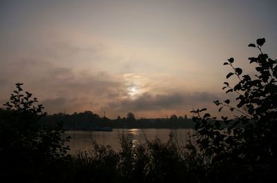 Scenic view of lake against sky during sunset