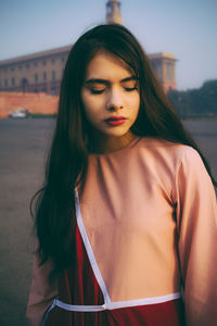 Portrait of beautiful woman standing outdoors