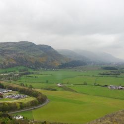 Scenic view of landscape against cloudy sky