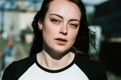 Close-up portrait of a serious young woman