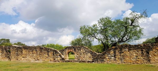 View of old ruin building against cloudy sky