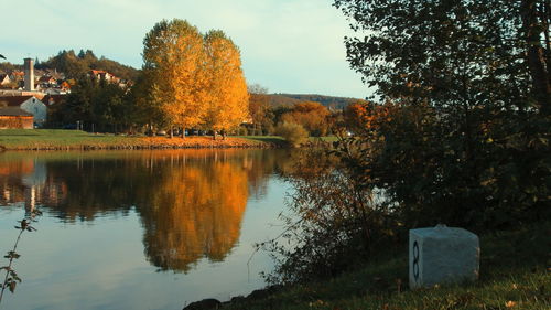 Scenic view of lake against sky during autumn