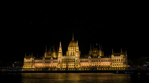Illuminated buildings at waterfront