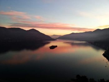 Scenic view of lake against sky during sunset