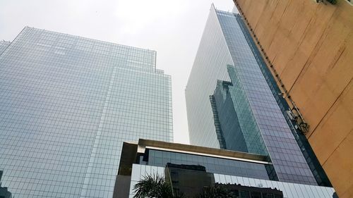 Low angle view of skyscrapers against sky