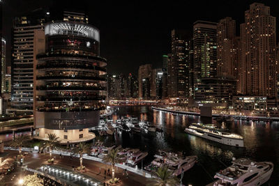 High angle view of illuminated buildings in city at night