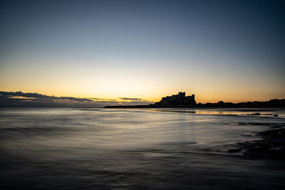 Scenic view of sea against sky at sunset