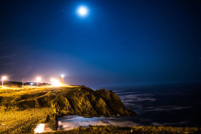 Scenic view of sea against sky at night