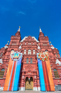 Low angle view of building against blue sky