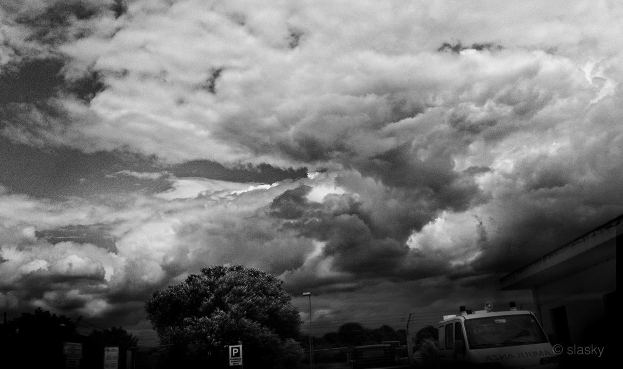 sky, cloud - sky, cloudy, weather, overcast, storm cloud, building exterior, low angle view, cloud, built structure, transportation, cloudscape, architecture, nature, silhouette, dramatic sky, dusk, outdoors, atmospheric mood, house