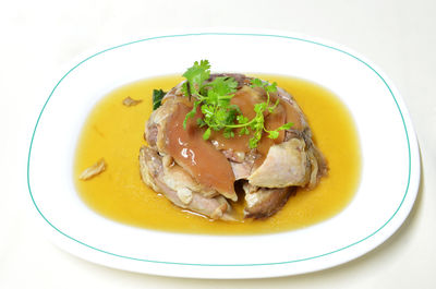 Close-up of fish served on table