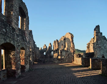 Old buildings against clear sky