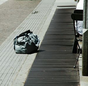 High angle view of messy resting on footpath