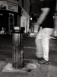 Woman standing at night
