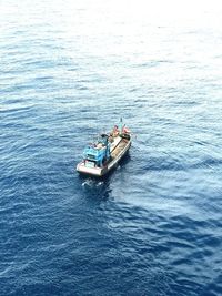 High angle view of boat sailing in sea