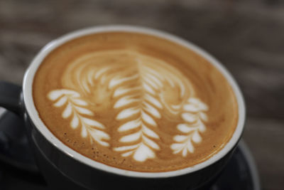 Close-up of cappuccino on table