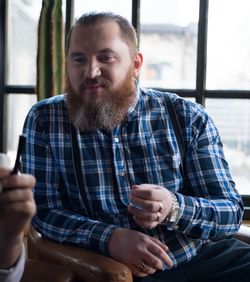 Man in suspender talking with woman at home