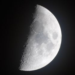 Low angle view of moon against clear sky at night