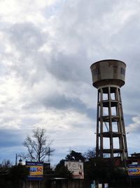 Low angle view of water tower against sky in city