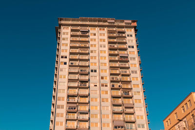 Low angle view of building against blue sky