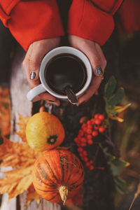 Close-up of hand holding pumpkin