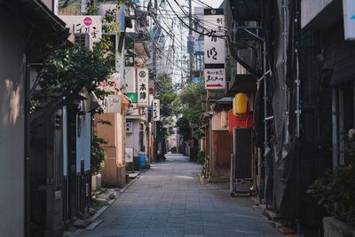 Narrow alley amidst buildings in city