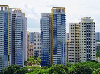 Modern buildings in city against sky