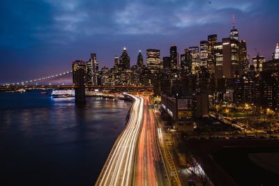 High angle view of illuminated bridge over river at night