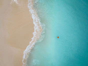 High angle view of people on sea shore