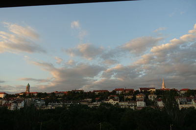 Townscape against sky during sunset