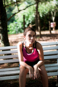 Portrait of teenage girl sitting on bench