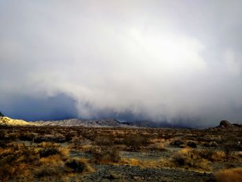 Smoke emitting from volcanic mountain against sky