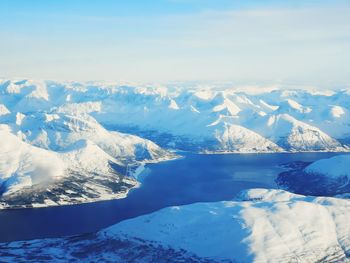 Scenic view of snowcapped mountains against sky