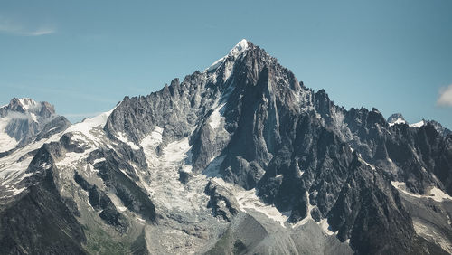 Panoramic view of snowcapped mountain against sky