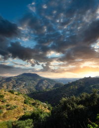 Scenic view of landscape against dramatic sky