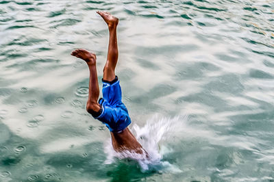 High angle view of man surfing in sea