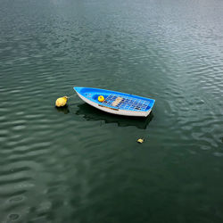 High angle view of boat floating on lake