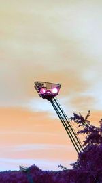 Low angle view of ferris wheel against sky