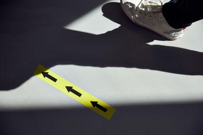 Low section of person on yellow table