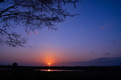 Scenic view of silhouette landscape against romantic sky at sunset