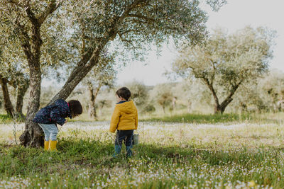 Brother ans sister playing outdoors