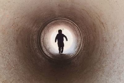 Blurred motion of man in tunnel