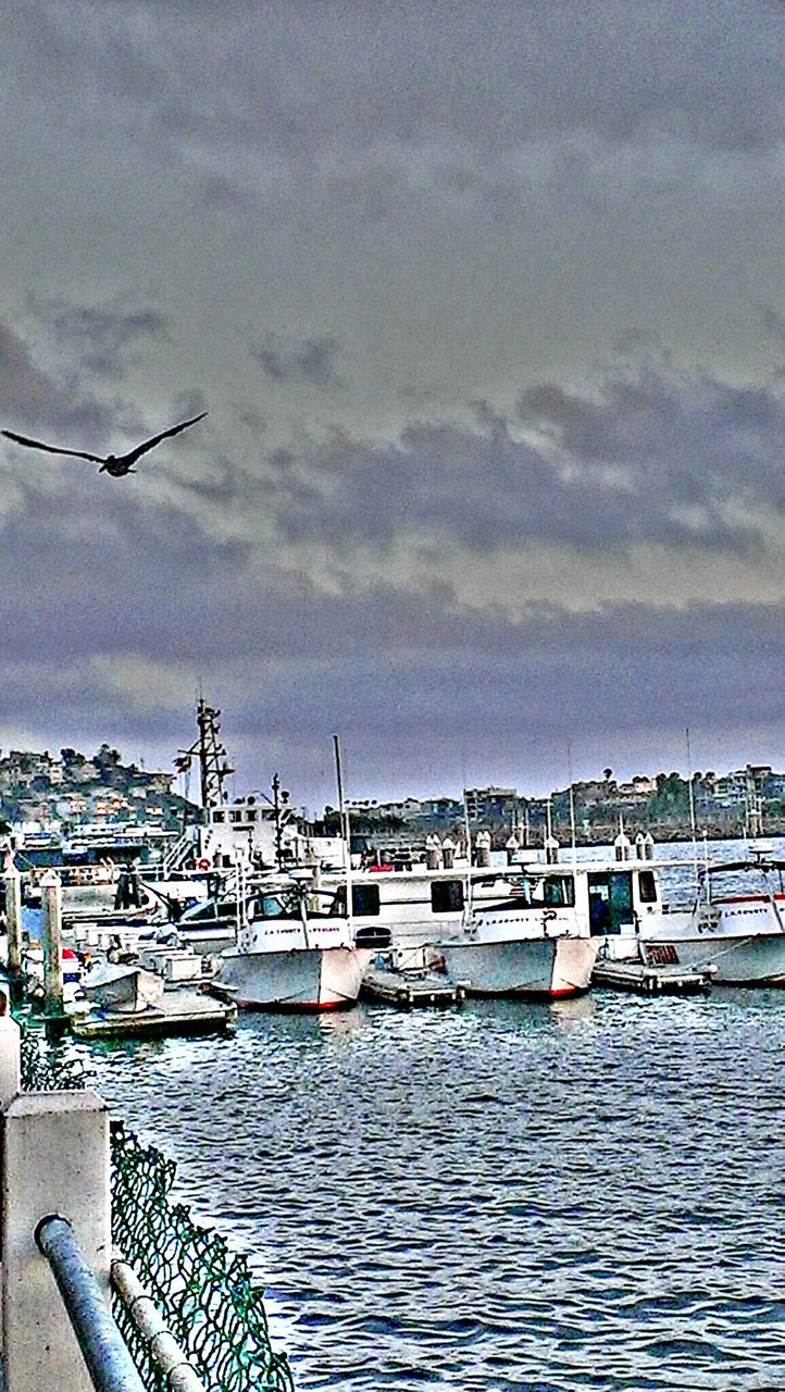 water, built structure, architecture, building exterior, sky, waterfront, sea, nautical vessel, cloud - sky, transportation, river, harbor, cloudy, cloud, rippled, day, mode of transport, boat, railing, nature