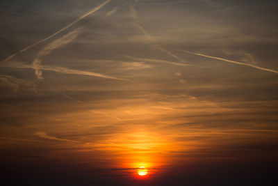 Low angle view of dramatic sky during sunset