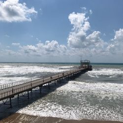 Pier over sea against sky