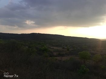 Scenic view of mountains against sky during sunset