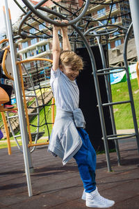 Smiling boy playing at park 