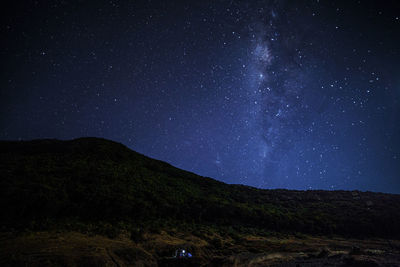 Low angle view of mountain against sky at night