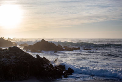 Sunset and rough waters