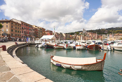 Boats moored at harbor